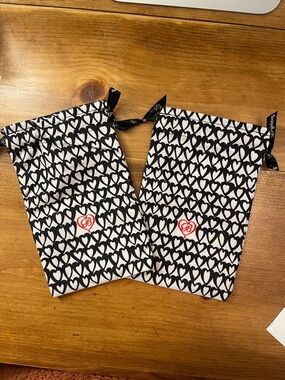 LgBrighton Black & White Heart Print Drawstring Pouches w/ Red Logo. 2 available